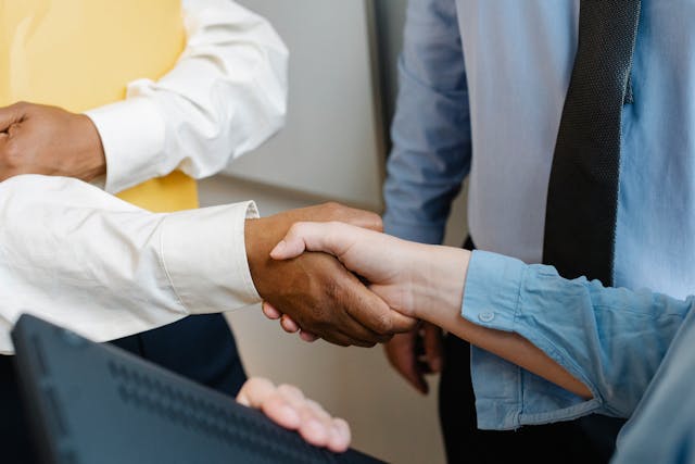 two people shaking hands